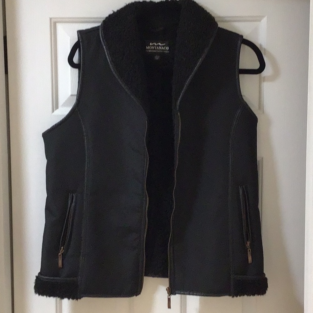 Super cute black zip up vest with zip pockets and Sherpa lining- from Montanaco
